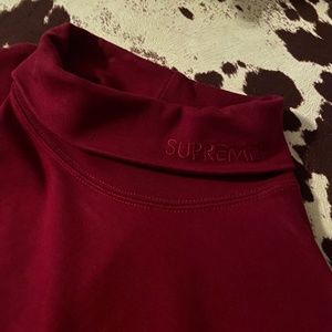 Supreme long sleeve turtleneck with logo on collar. Solid burgundy.